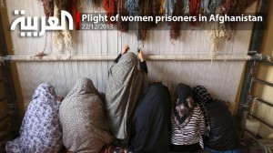 Afghan female prisoners weave a carpet at a workshop in Herat prison, western Afghanistan